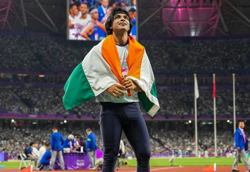 Neeraj Chopra waved the national flag after winning gold at the 2023 Asian Games