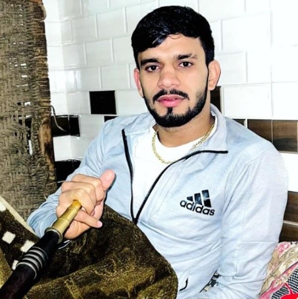 Neeraj Narwal while smoking hookah