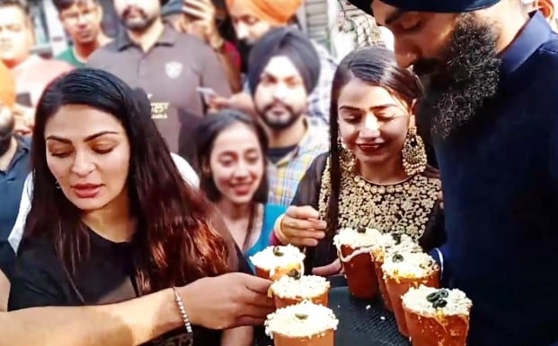 Neeru Bajwa, a Punjabi film actress, with the Kulhad Pizza Couple