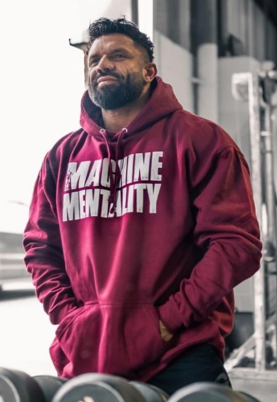 Neil Currey wearing a hoodie of his brand, Machine Mentality