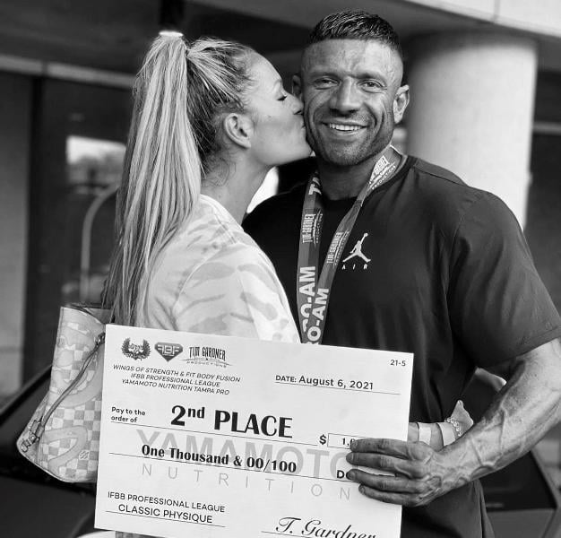 Neil Currey with his girlfriend, Becci Grant, after 2nd place finish at the Tampa Pro