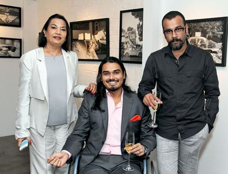 Nicholai Sachdev (centre) while having wine