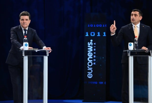 Nicușor Dan in a debate with George Simion (right)
