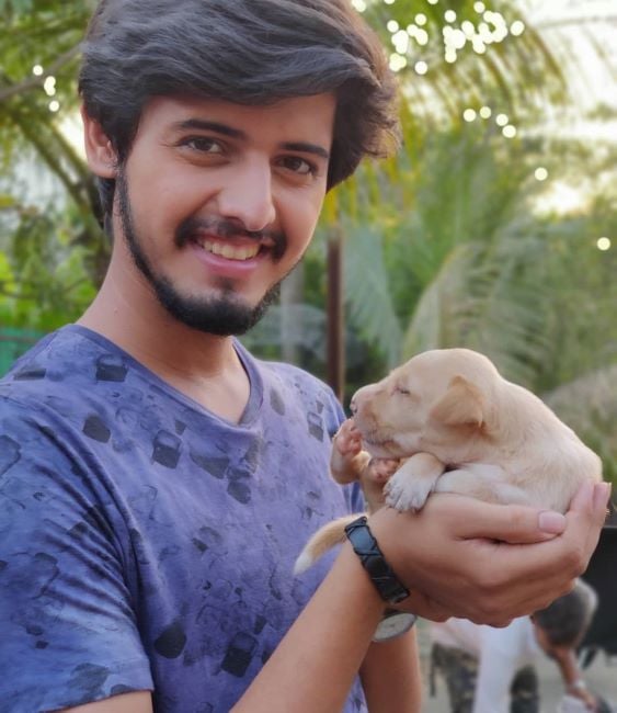 Nikhil Damle with a puppy