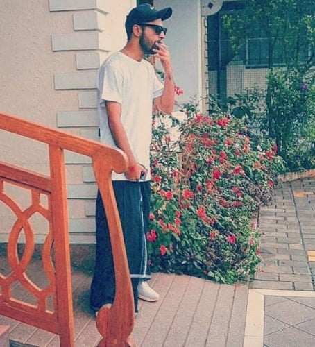 Nikhil Mehta smoking a cigarette