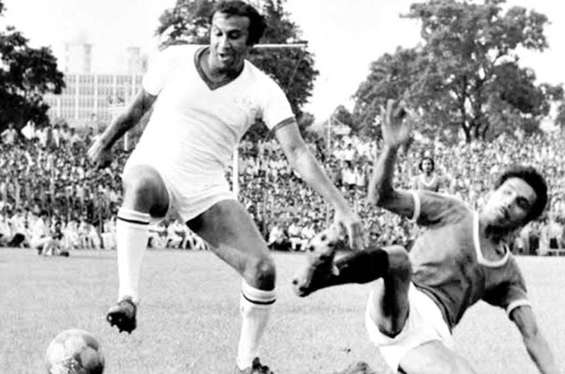 Nikhil Nandy (right) tackling PK Banerjee during a football match