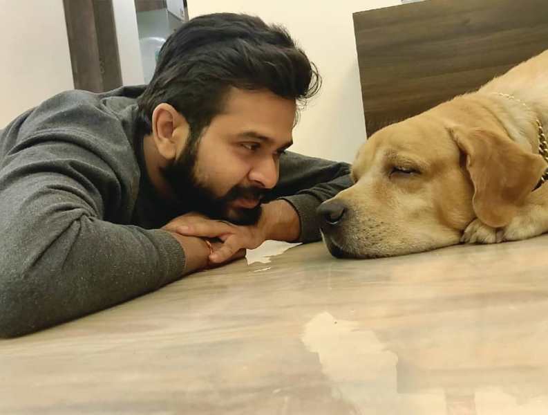 Nikhil Rajeshirke with his pet dog named Guru