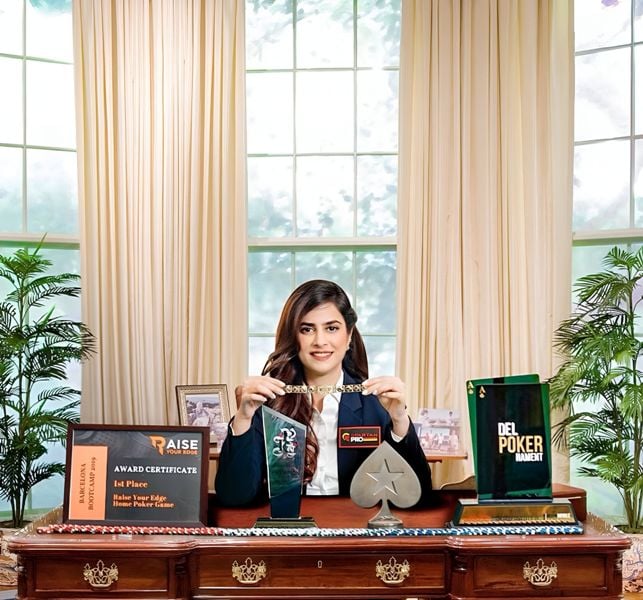 Nikita Luther, while posing with awards, which she received over the years