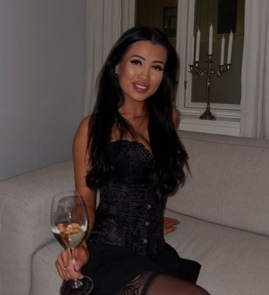 Nini Diem drinking wine