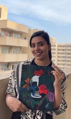 Nisha Mishra with her painting