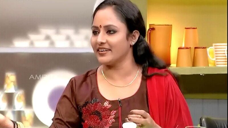 Nisha Sarangh in a still from the Malayalam cookery competition show titled 