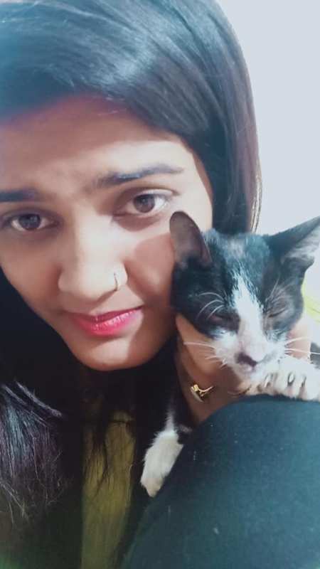 Nisha Upadhyay playing with her cat