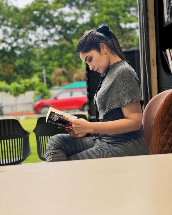 Nishitha Gowda reading a book