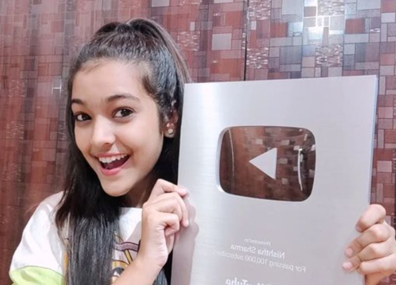 Nishtha Sharma posing with YouTube silver button