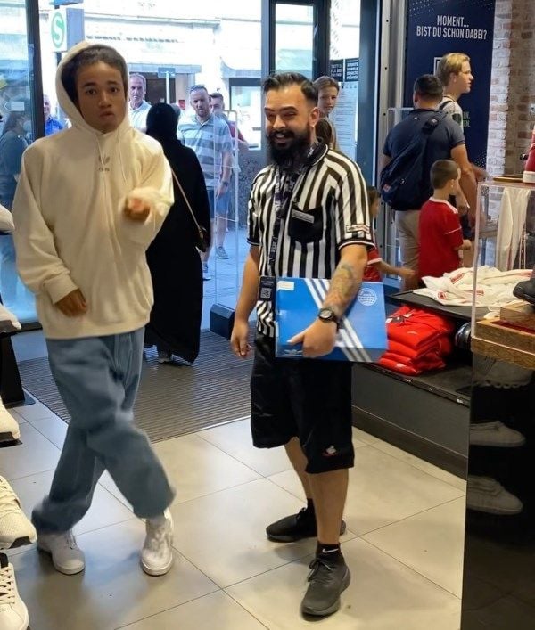 Noel Robinson (left) vibing in a footwear showroom