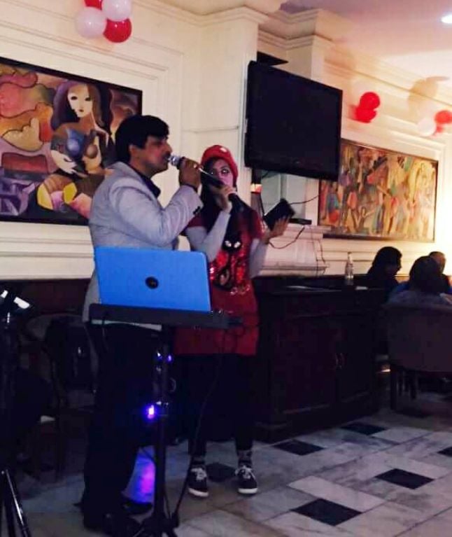 Noor singing at an event