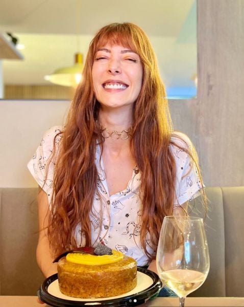 Norma Nivia drinking wine