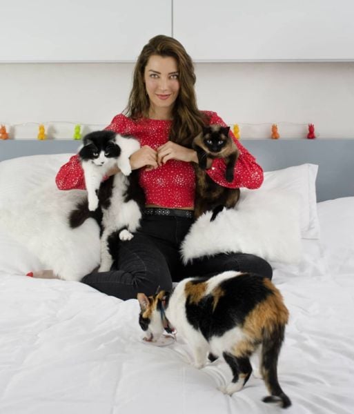 Norma Nivia with her pet cats