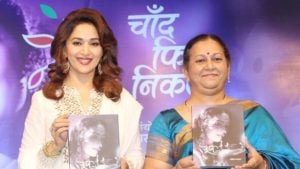 Nutan- Lalita Tamhane showing her book written on 