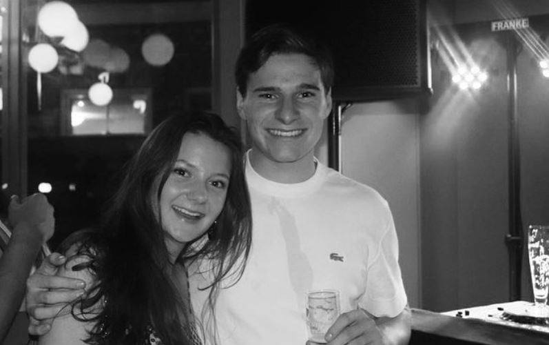 Oliver Daemen while holding a glass of alcohol