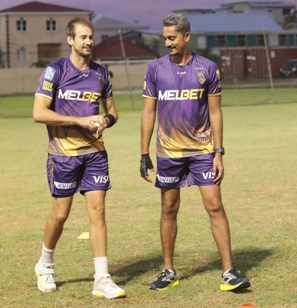 Omkar Salvi (right) with a player of KKR