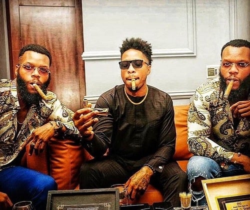 Oseloka Mbadiwe and Ozumba Mbadiwe smoking cigars