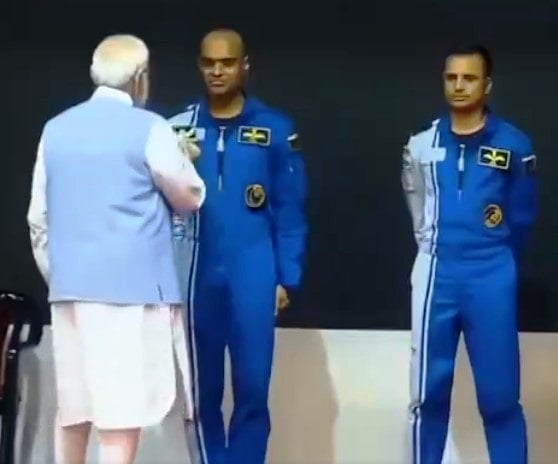 PM Narendra Modi pinning the astronaut wings on the uniform of Prashanth Balakrishnan Nair