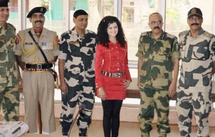 Palak Muchhal while posing with CRPF personnel after a charity show