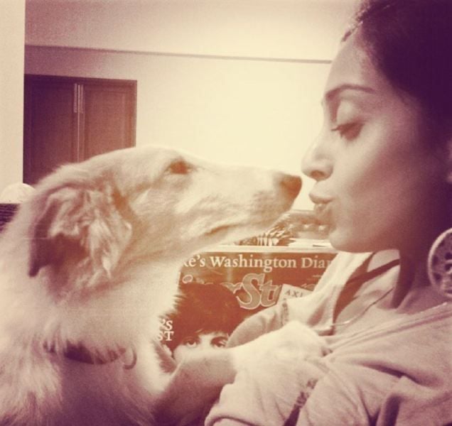 Pallavi Vengsarkar cuddling with her pet dog