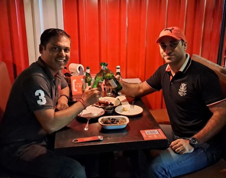 Pankaj Bhatia (right) drinking beer with his friend