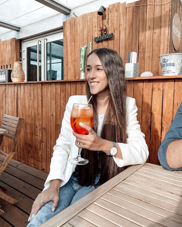 Patrícia Carvalho while having an Italian wine-based cocktail