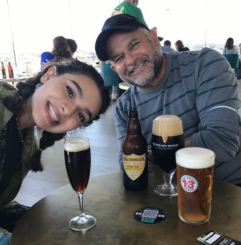 Paulina Chávez with a glass of alcohol