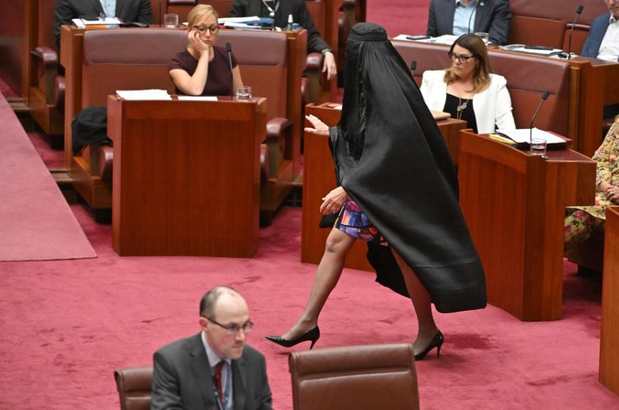 Pauline Hanson walking on the Senate floor wearing burqa