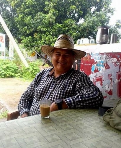 Peepal Baba with a glass of tea