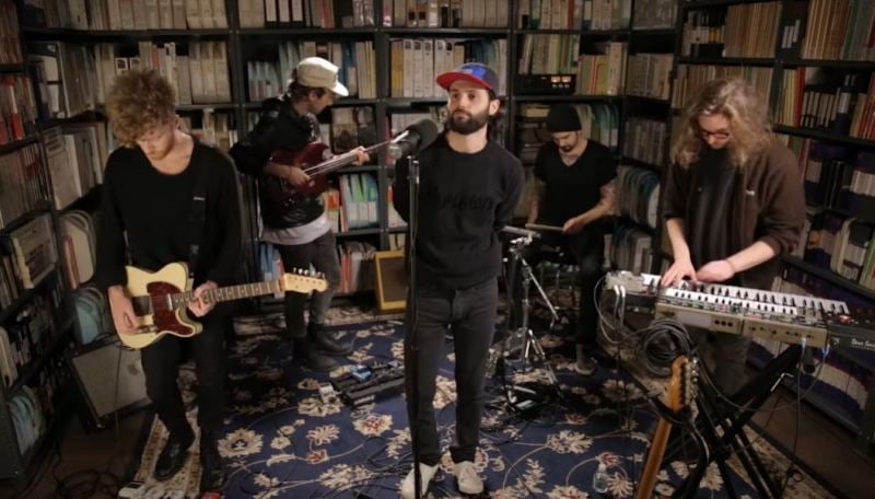 Penn Badgley and the other band members while recording a song for the album 