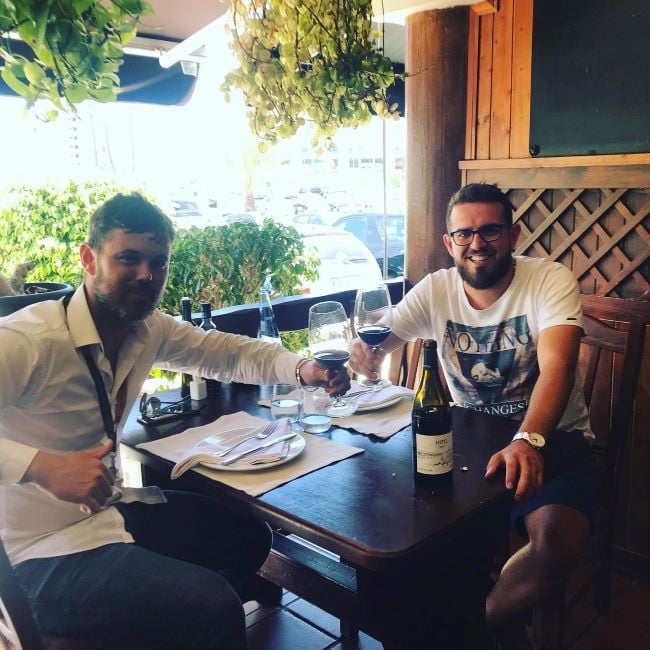Petar Grishev drinking alcohol with his friend