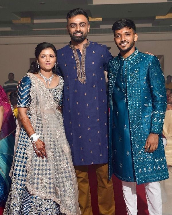 Photo of Jaydev Unadkat (centre) with Chetan Sakariya and Meghna Jambucha at their wedding