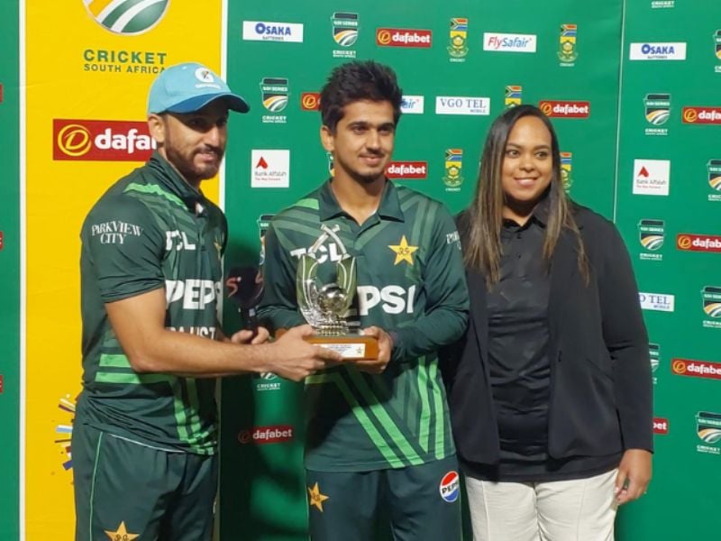 Photo of Salman Ali Agha and Saim Ayub posing with POTM award