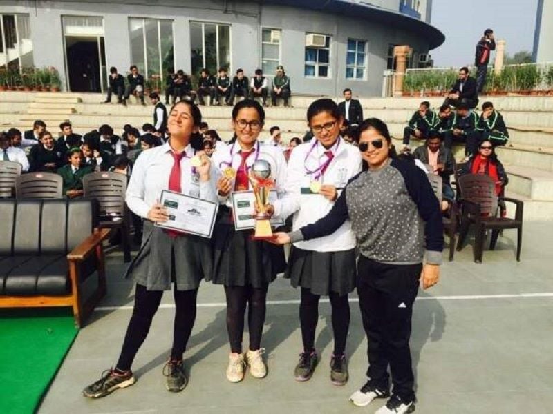 Pinki Singh with her students after winning a tournament