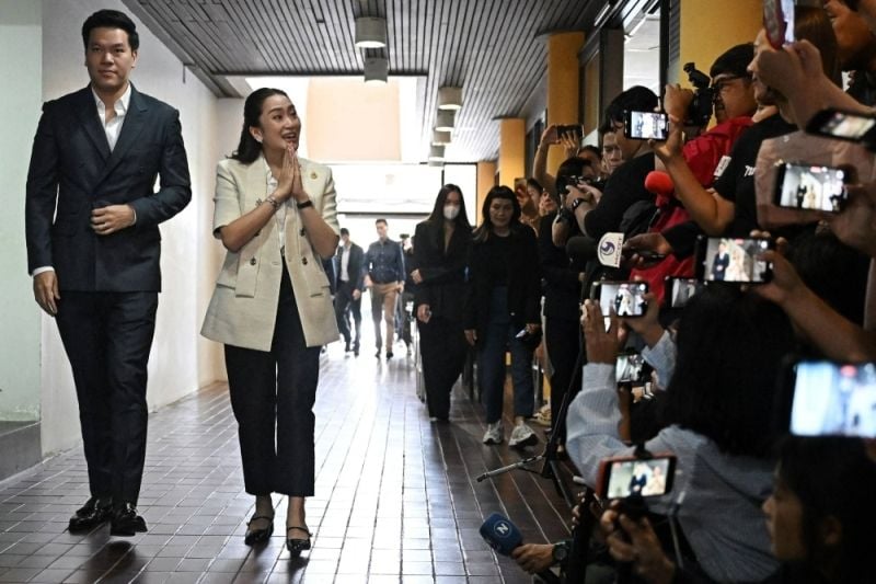 Pitaka Suksawat, along with Paetongtarn Shinawatra, at the studio of the local news outlet Voice TV in Bangkok