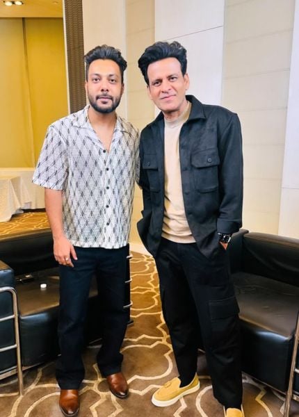 Piyush Gujjar (left) with the Indian actor Manoj Bajpayee after completing a podcast for their YouTube channel
