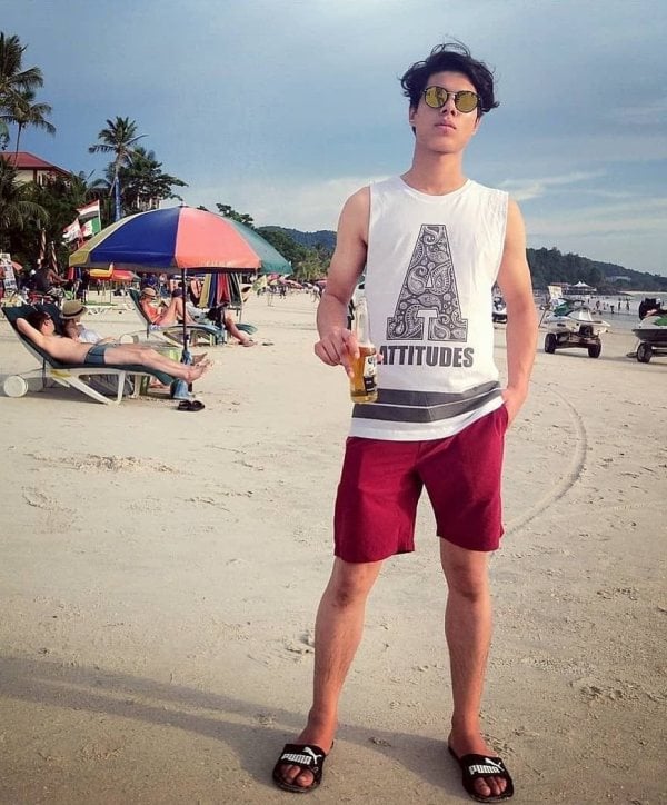 Piyush Khati while holding a bottle of beer