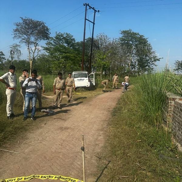 Police officials at Anil Dujana