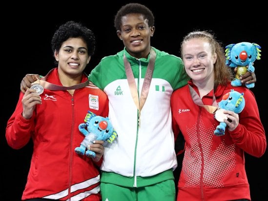 Pooja Dhanda (left) won a silver medal at the 2018 Commonwealth Games.