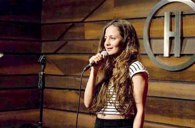 Pooja Ruparel doing stand-up comedy