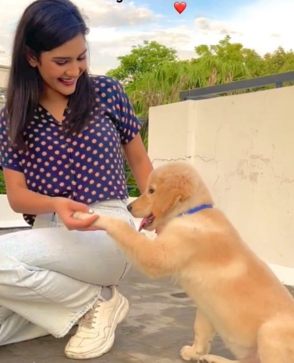 Pooja Sharma with a dog