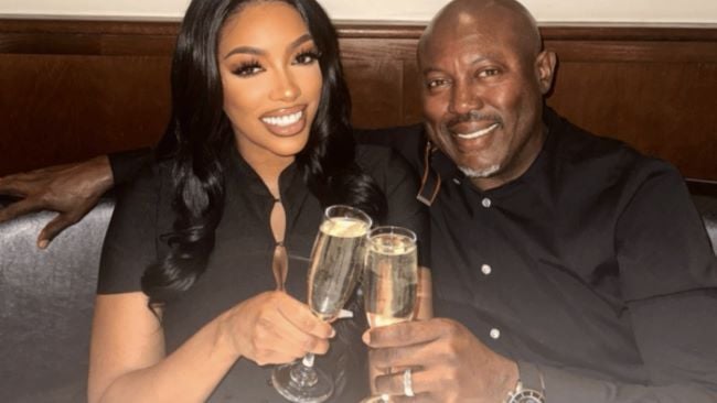 Porsha Williams holding a glass of champagne