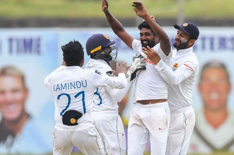 Prabath Jayasuriya celebrating with his teammates after taking a wicket against Ireland