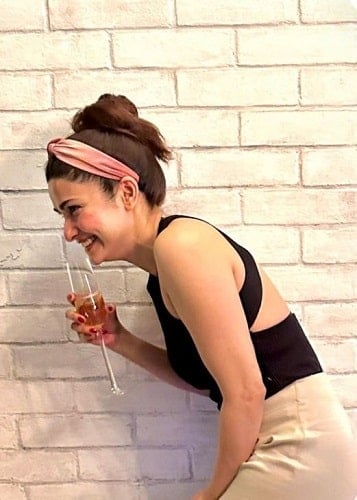 Prachi Desai holding a glass of wine