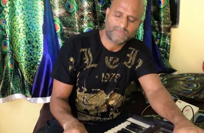 Pradeep Kabra singing and playing harmonium at his home